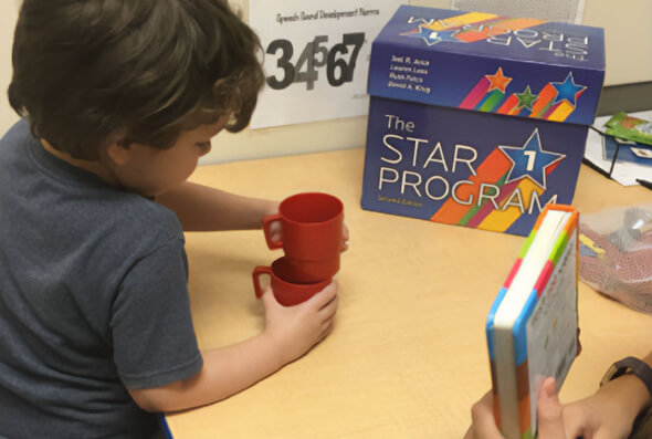 Kid using the STAR program during therapy